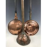 Two 19th Century bed warming pans together with a poss stick