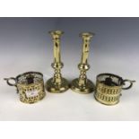 A pair of early Victorian brass push-eject candlesticks together with a pair of early 19th Century