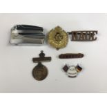 Collectors' items comprising a Ronson Varaflame lighter together with Army cap and collar badges,