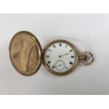 A rolled-gold hunter pocket watch, having a white enamelled dial and Roman numerals, 4 cm diameter