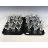 A quantity of crystal wine glasses together with sherry glasses etc