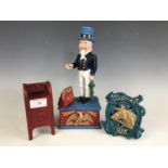 Three reproduction cast-iron money boxes / savings banks, including a mechanical "Uncle Sam", a