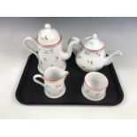 An Arthur Wood four piece tea / coffee set, decorated with a floral sprig