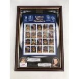 A Benham's framed US Classic Movie Monsters stamp sheet signed by Ingrid Pitt and (Sir)