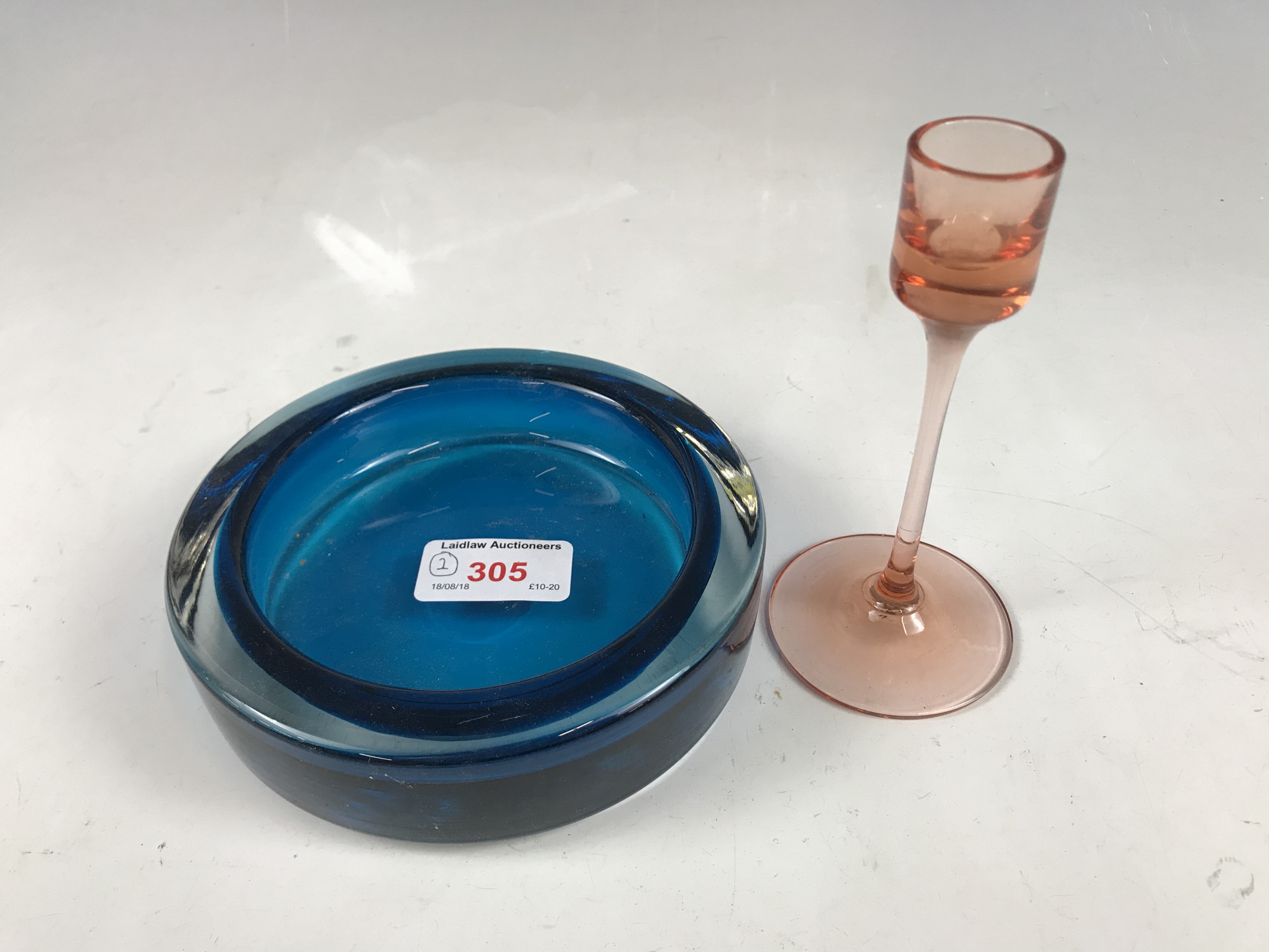 A Wedgwood pink glass candlestick, together with a Whitefriar's type glass dish