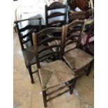 Four late 18th / early 19th Century rush-seated ladder back chairs