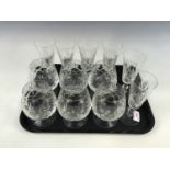 A set of six crystal brandy glasses together with six crystal wine glasses