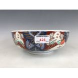 A Meiji Japanese Imari bowl, the decoration incorporating circular with depictions of cranes in