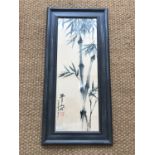 An oriental brush painting of bamboo, with red seal mark, framed and mounted under glass, 79 x 28 cm