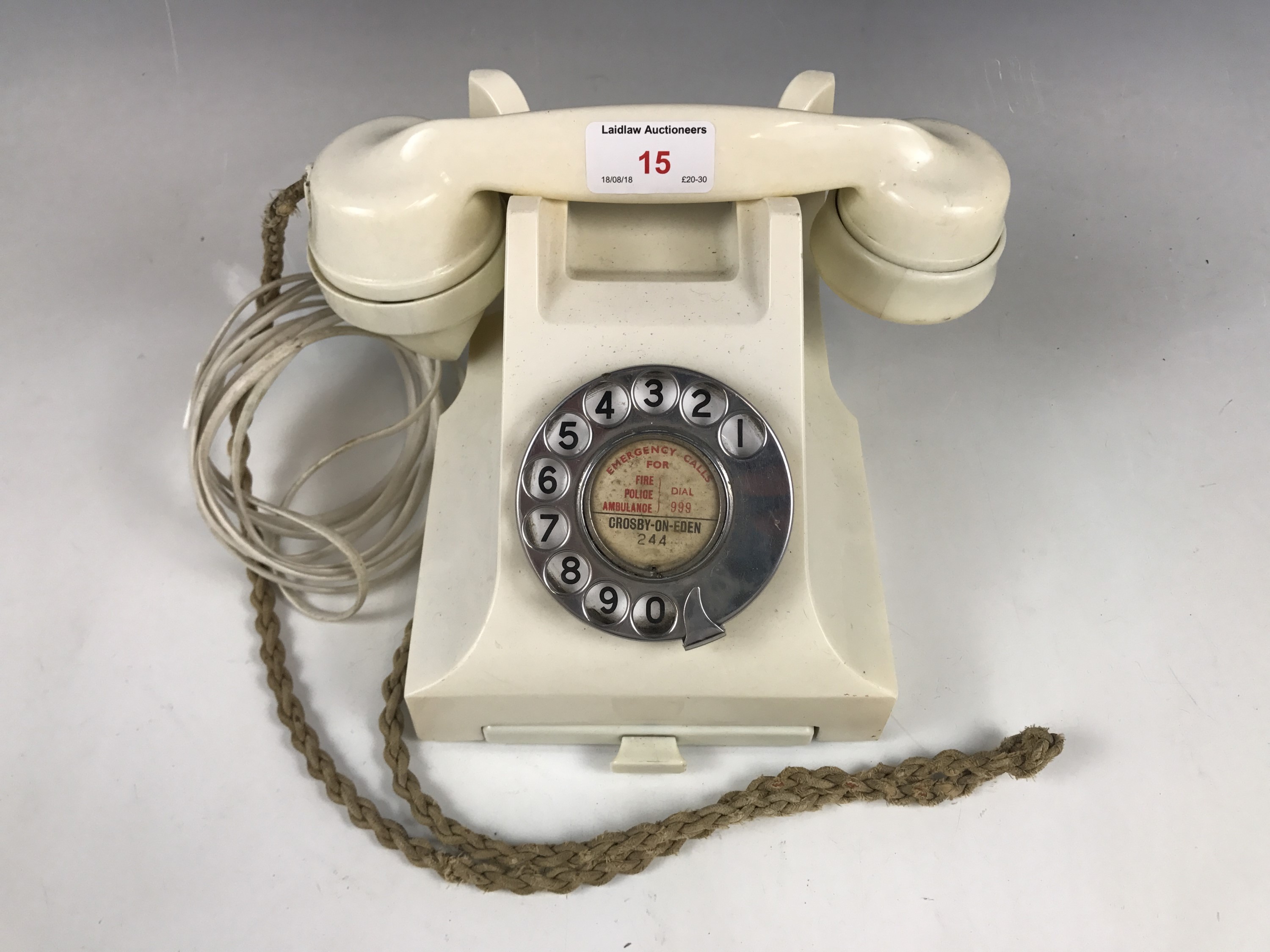 A vintage cream GPO telephone, wired for modern use