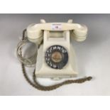A vintage cream GPO telephone, wired for modern use