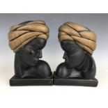 A handed pair of Alexander Backer painted plaster busts depicting Nubian Princesses, stamped ABCO,
