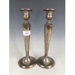 A pair of American white-metal candlesticks, stamped 'sterling'