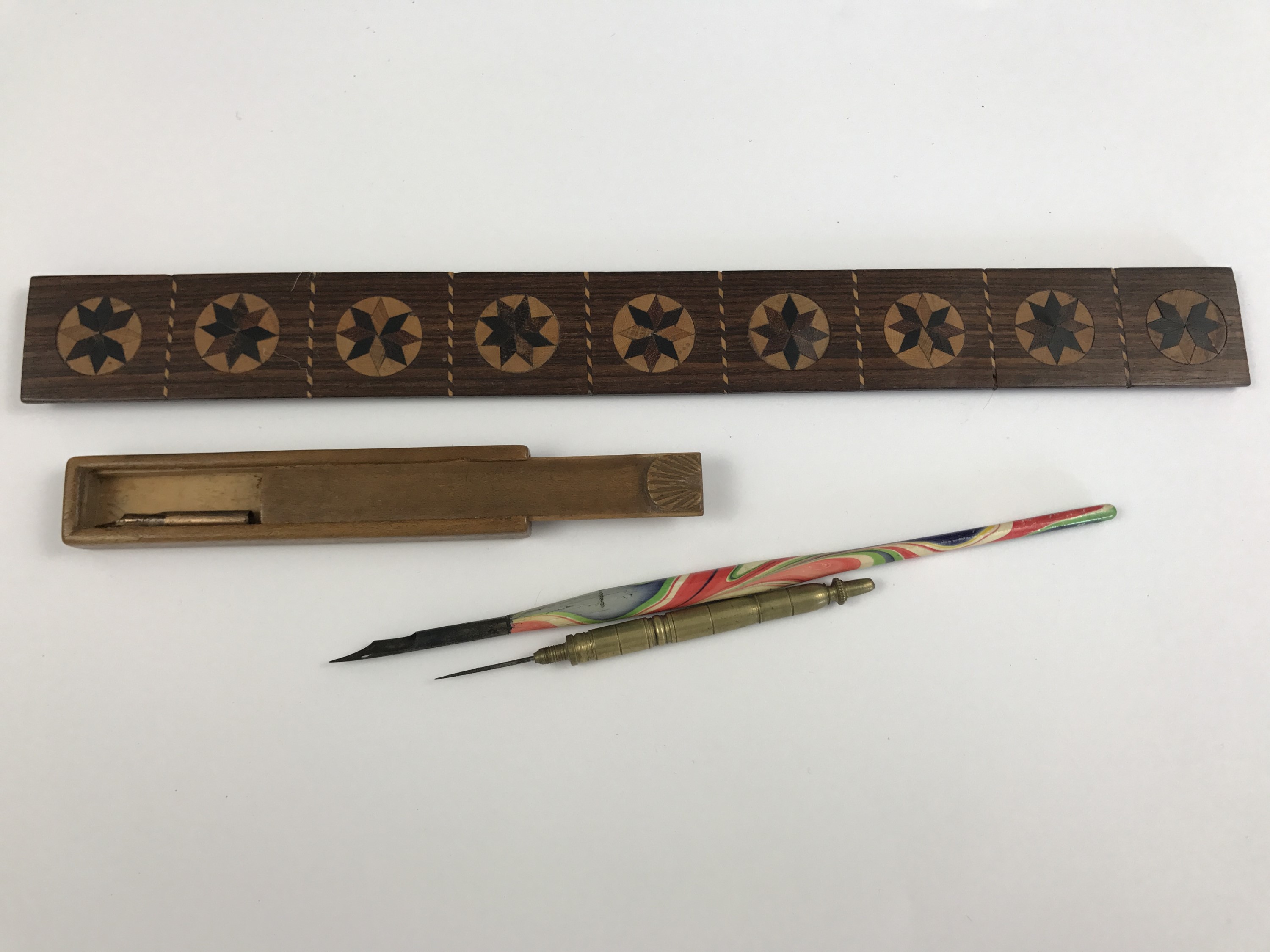 19th Century writing instruments including a marquetry inlaid straight edge, a Mauchline ware nib