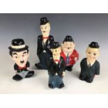 Five novelty painted plaster money boxes / savings banks modelled as Stan Laurel and Oliver Hardy,