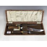 A cased 1940s antler-handled carving set