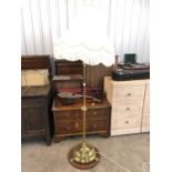 A Victorian brass standard lamp with cream shade