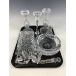 A quantity of cut glass including candlesticks, a cheese dome and a Waterford crystal ashtray etc