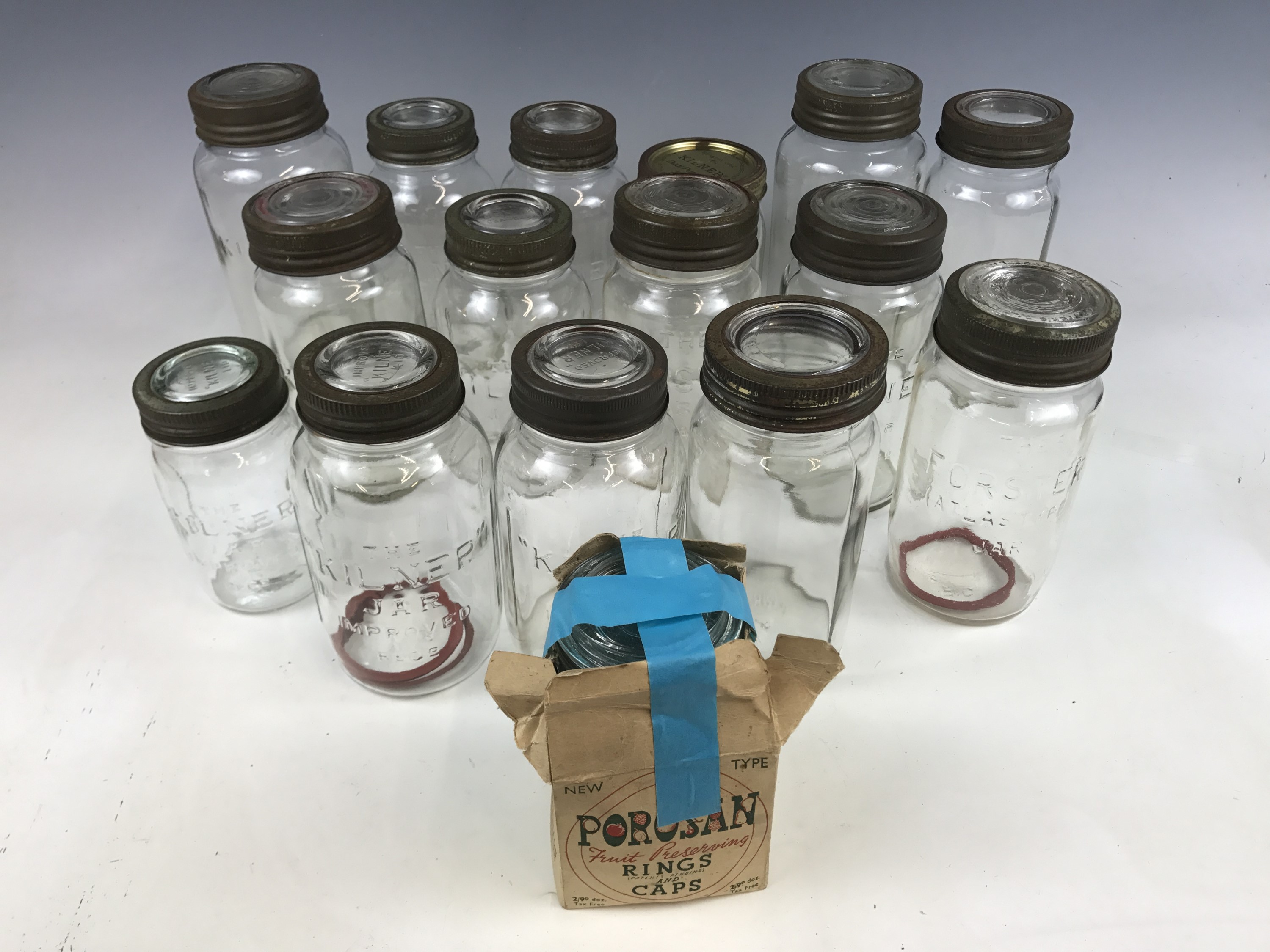A number of vintage glass Kilner preserving jars