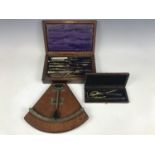 A Victorian mahogany cased drawing instrument set, together with one other smaller example, and a