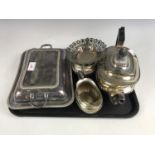 An electroplate three-piece tea set together with an entree dish and a bon bon dish