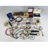 A large quantity of vintage and other costume jewellery and watches