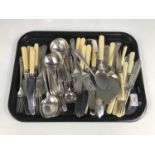 A quantity of electroplate cutlery including a bread knife and a spork etc