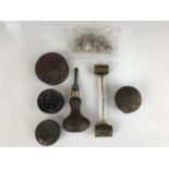 An antique doubled-ended brass gunpowder / shot measure, antique percussion cap tins, and shot etc.