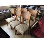 A set of six fully-restored Egyptianate dining chairs, in blonde beech with re-upholstered over-