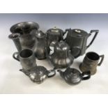 A 19th Century James Allan Britannia-metal tea pot together with other tea pots, tankards, and a