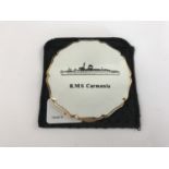 A vintage Stratton powder compact having a "RMS Carmania" cover