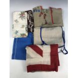 Vintage textiles including two printed cotton cushion covers and two handmade linen aprons etc.