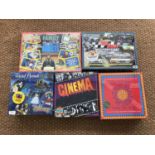 Five unopened board games including a 1992 Waddington's Family Telly Addicts, a Disney trivial