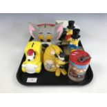 A number of children's money boxes / savings banks, to include the bust of Tom cat from "Tom and