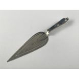 A Victorian silver novelty book mark modelled as a trowel, the handle set with polished agate,