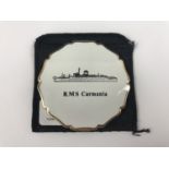 A vintage Stratton powder compact having a "RMS Carmania" cover