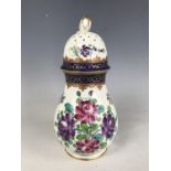 A 19th Century tin glazed caster decorated with hand-enamelled blossom (a/f)