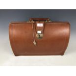 A vintage Cheney leather briefcase with key