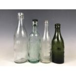 Four various Cumbrian glass bottles