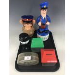 Six advertising money boxes / savings banks, including a Homepride Fred, an Esso money box, a