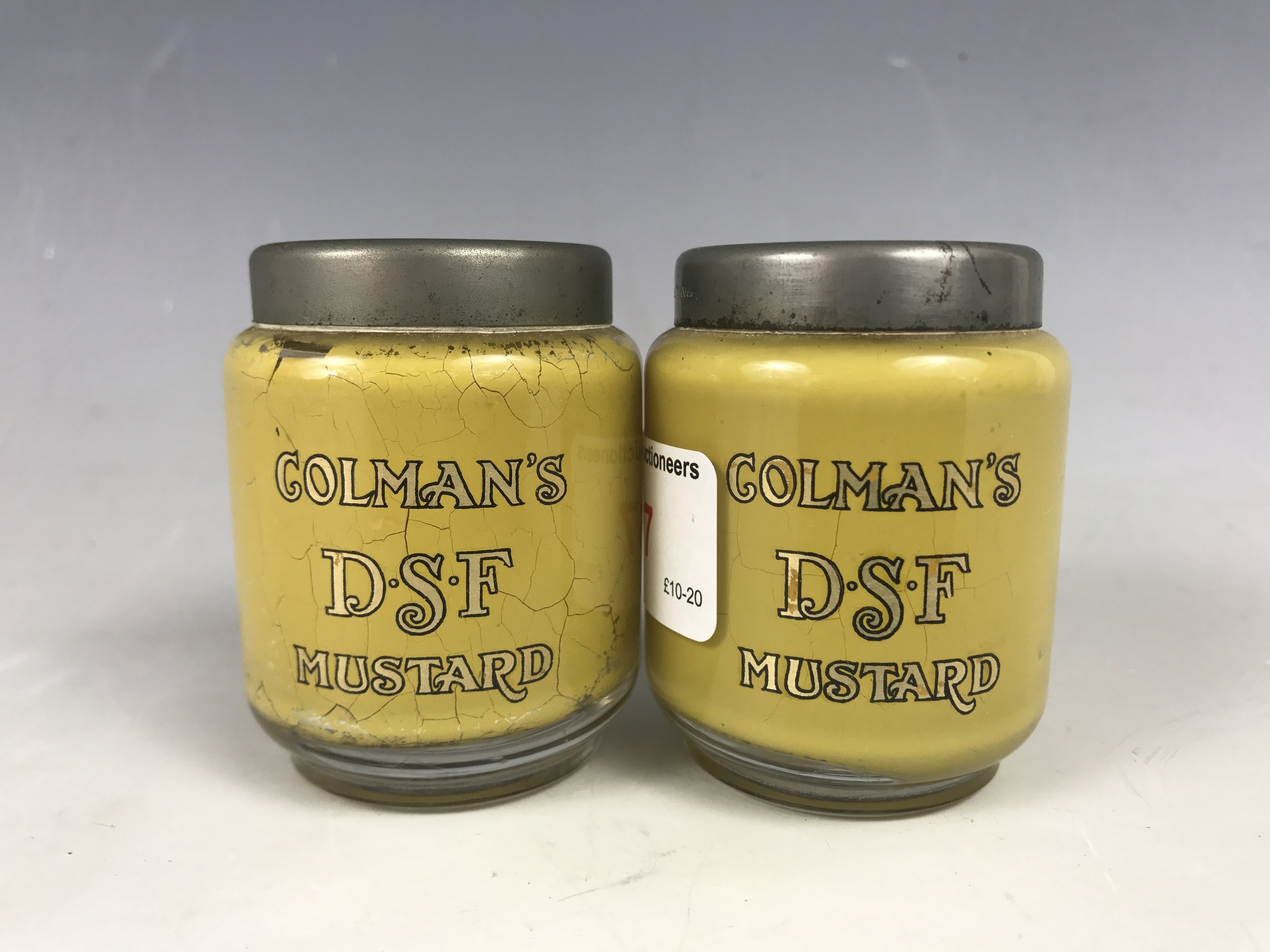 A pair of late 19th century D.G. Ware Colmans DSF Mustard glass cruets