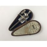 A late Victorian patent champagne tap in leather case