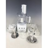 A Magimix IE Mini Plus food processor with accessories