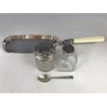 Two Victorian silver / white metal mounted cut glass toiletry jars, a silver coffee spoon, and an