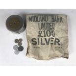 A small quantity of European coins, a Midland Bank savings box and printed cotton bulk coins bag