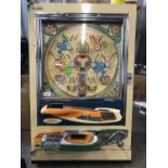 A 1960s-1970s Sanyo Pachinko slot machine, with balls and keys, (a/f)