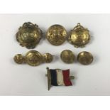 A group of Great War military sweetheart brooches, buttons and a flag brooch