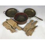 Antique kitchenalia including wooden butter pats and three copper pans
