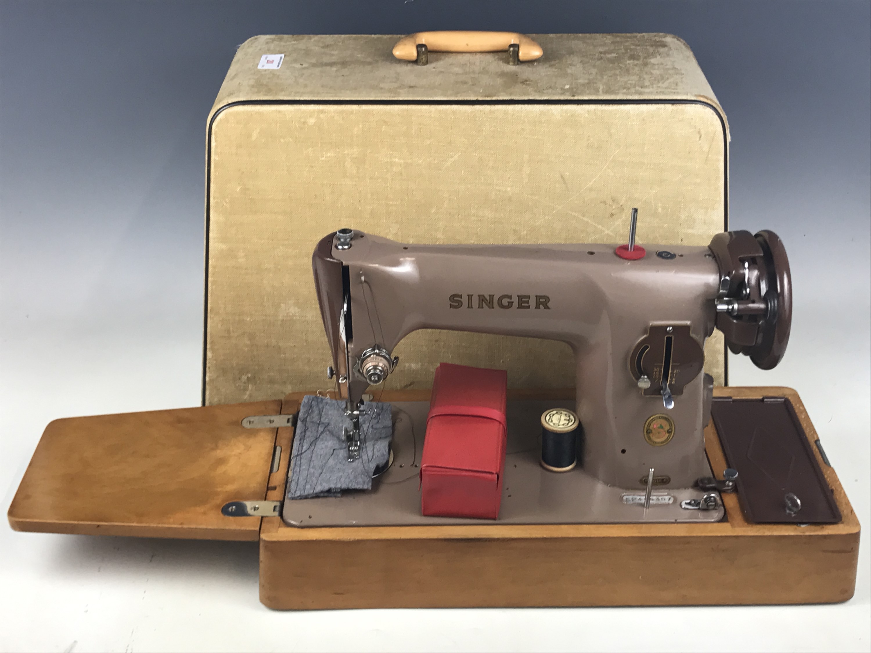 A cased Singer sewing machine, model EP486307