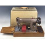 A cased Singer sewing machine, model EP486307